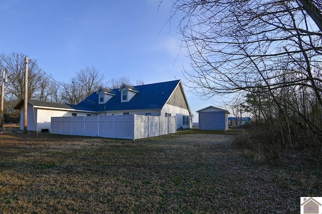 1706 Lane-A Rd, Paducah, KY 42003 - view of side of property featuring an outbuilding, a lawn, and fence