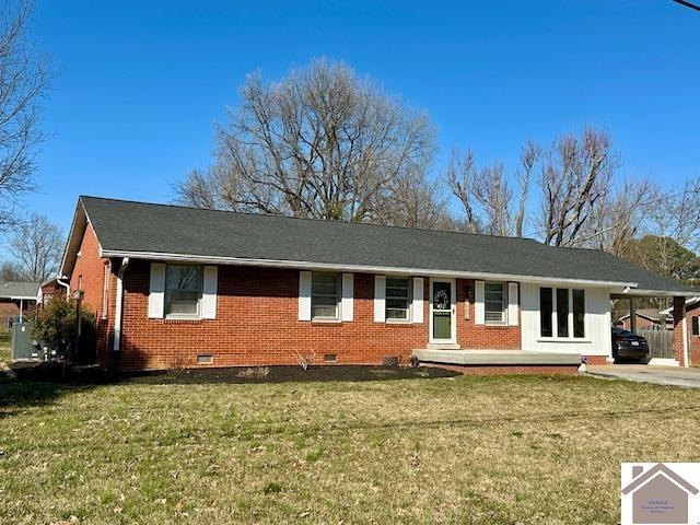 view of front of property featuring crawl space, an attached carport, driveway, and brick siding