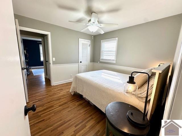 bedroom featuring wood finished floors, baseboards, a closet, and ceiling fan