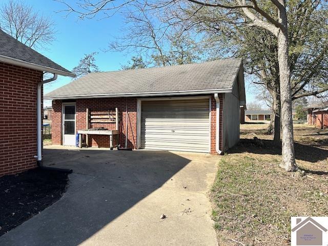 garage featuring driveway