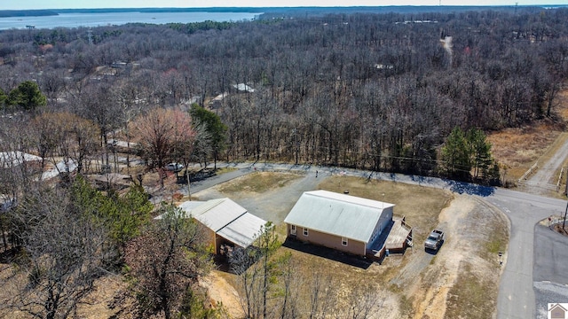 bird's eye view featuring a wooded view