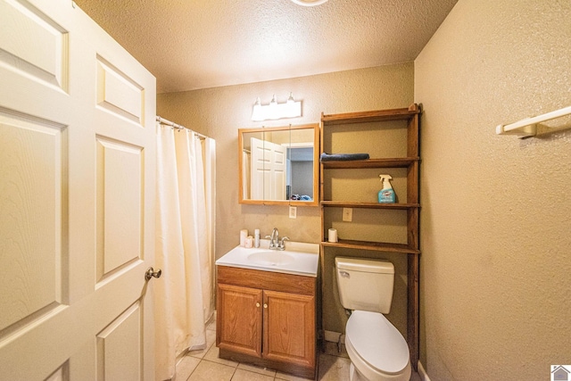 full bathroom featuring tile patterned floors, toilet, and a textured wall