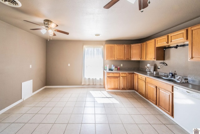 kitchen featuring a ceiling fan, light tile patterned floors, visible vents, and white dishwasher