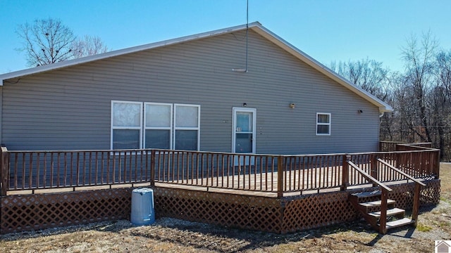 back of property with a wooden deck