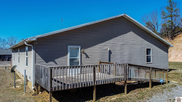 back of house featuring a wooden deck