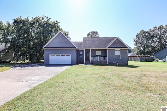 ranch-style house featuring a porch, a garage, driveway, and a front lawn