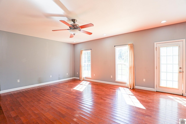 unfurnished room featuring recessed lighting, a ceiling fan, baseboards, and wood-type flooring