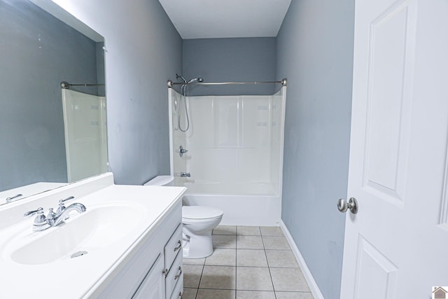 full bathroom with tile patterned floors, toilet, shower / bathing tub combination, baseboards, and vanity