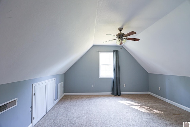 bonus room with baseboards, ceiling fan, carpet flooring, and vaulted ceiling