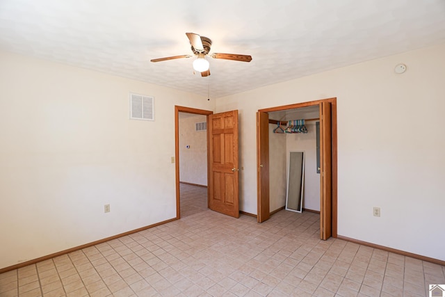 interior space with visible vents, a ceiling fan, and baseboards