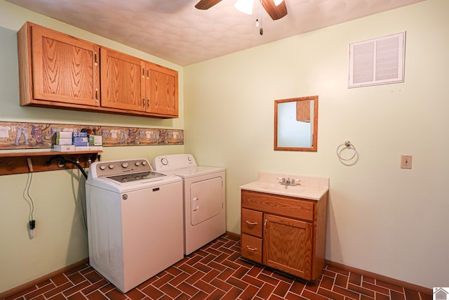 laundry room featuring washer and dryer, a sink, baseboards, and ceiling fan