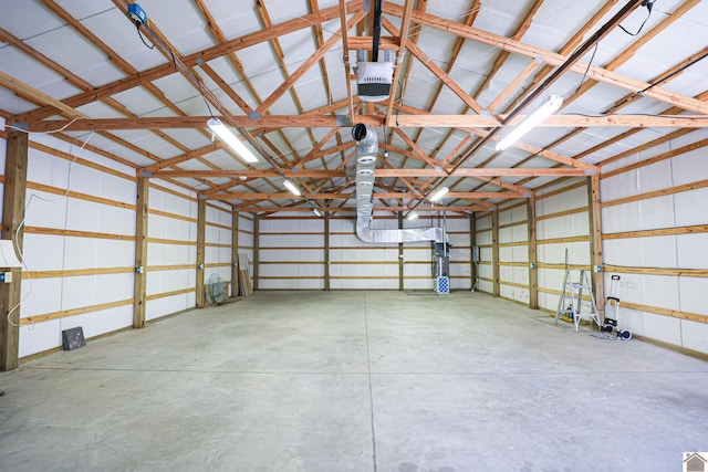 garage featuring metal wall and a garage door opener