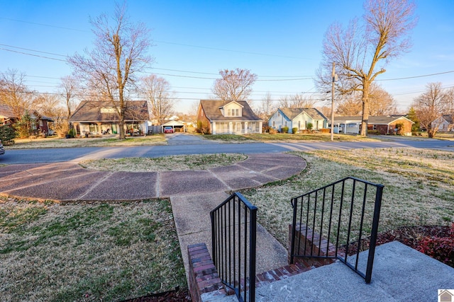 view of yard featuring a residential view