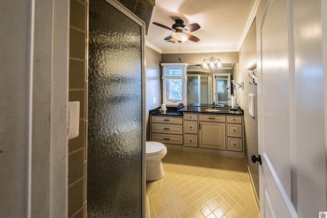 bathroom featuring a stall shower, toilet, ornamental molding, and vanity