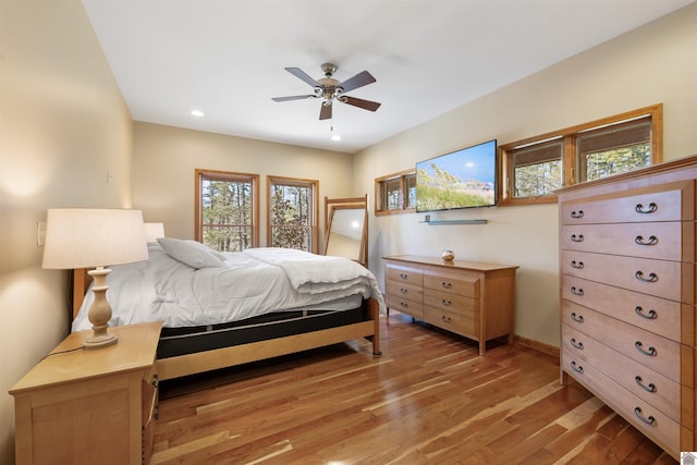 bedroom with ceiling fan, baseboards, light wood-style flooring, and recessed lighting