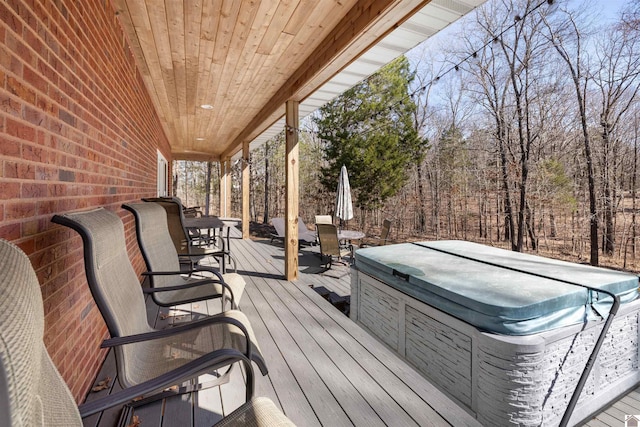 deck with a hot tub