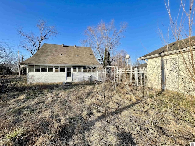 back of property with fence