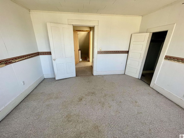 unfurnished bedroom featuring carpet