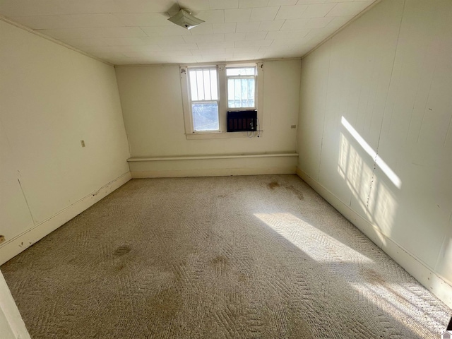 unfurnished room with light colored carpet