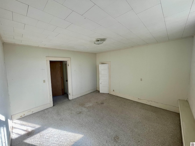 unfurnished bedroom featuring light carpet