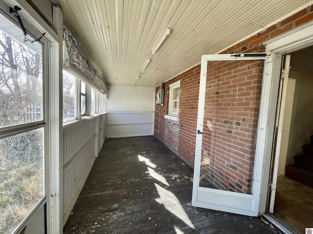 unfurnished sunroom featuring wooden ceiling