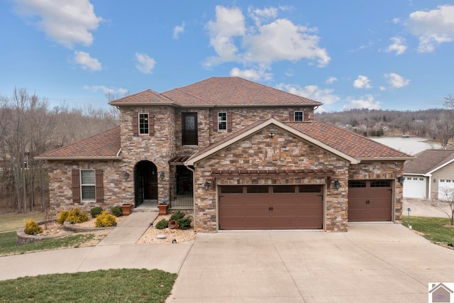 view of front facade with concrete driveway, a garage, and roof with shingles