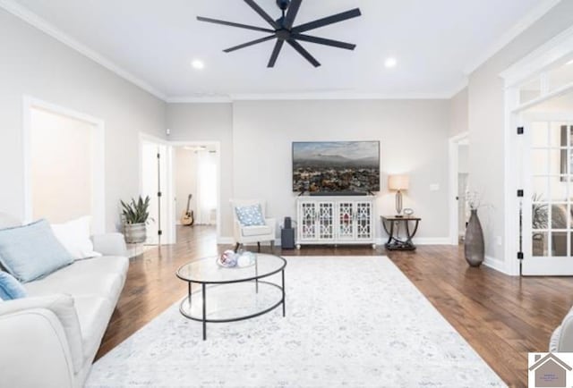 living room with ornamental molding, wood finished floors, recessed lighting, baseboards, and ceiling fan