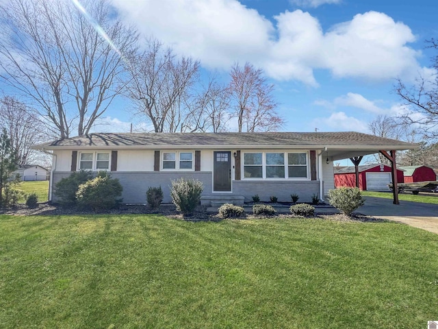 ranch-style home featuring brick siding, an attached carport, driveway, and a front yard