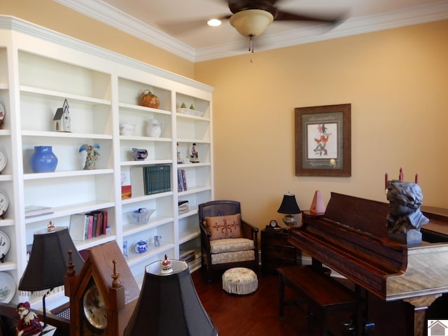 sitting room featuring a ceiling fan, wood finished floors, and ornamental molding