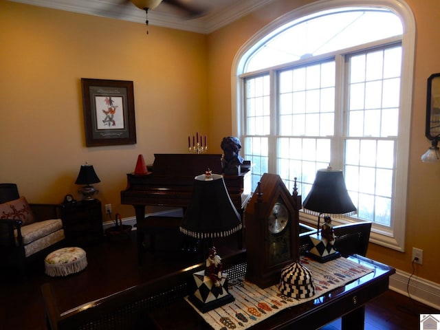 office area with crown molding, baseboards, and wood finished floors