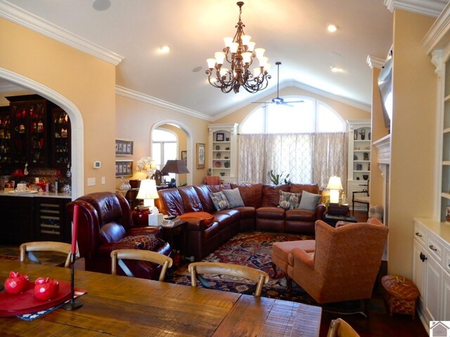 living area featuring lofted ceiling, arched walkways, ceiling fan, a bar, and ornamental molding