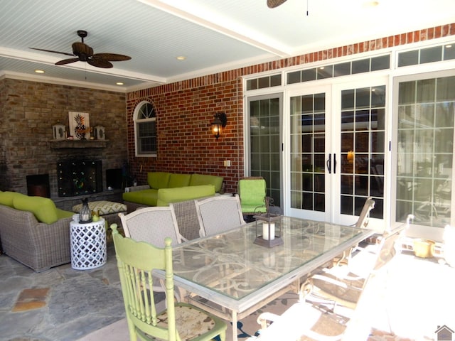 view of patio featuring french doors, an outdoor hangout area, outdoor dining area, and a ceiling fan