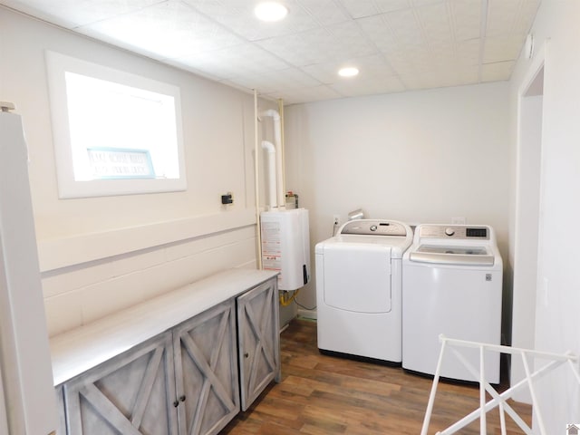 laundry room featuring laundry area, recessed lighting, dark wood-style flooring, water heater, and washer and dryer