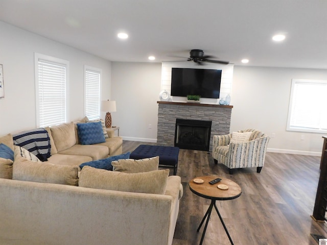 living area with baseboards, recessed lighting, a fireplace, wood finished floors, and a ceiling fan