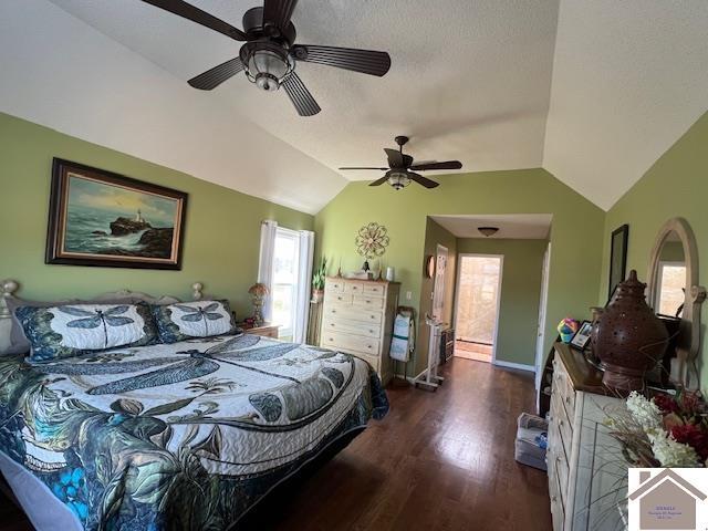 bedroom with a ceiling fan, lofted ceiling, wood finished floors, and baseboards