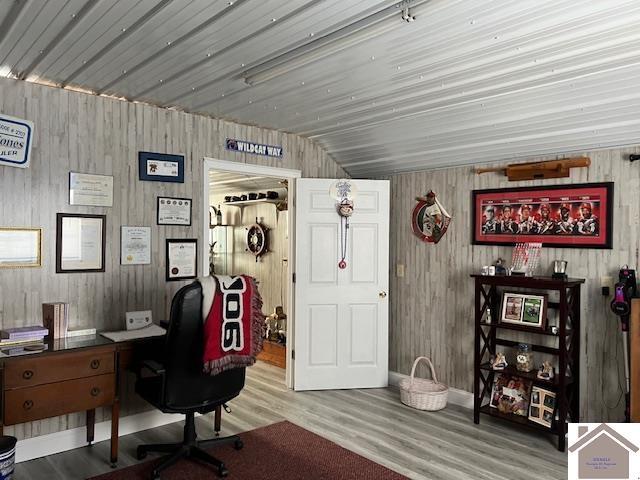 home office with wood finished floors