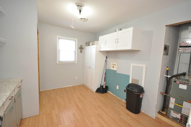 laundry area featuring hookup for a washing machine, visible vents, and light wood-style flooring