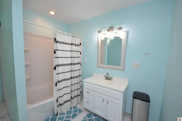 full bathroom featuring recessed lighting, shower / bath combo with shower curtain, and vanity