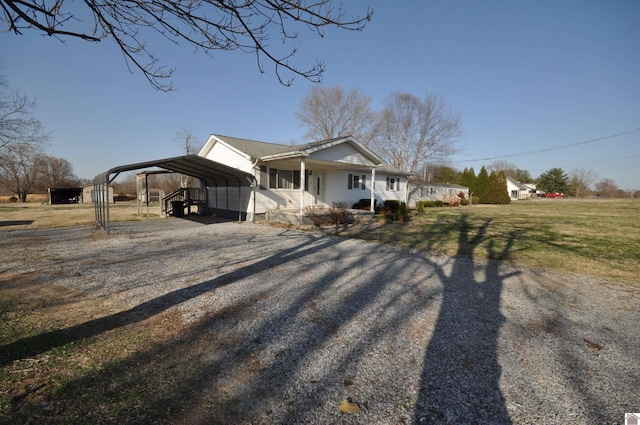 view of property exterior featuring a yard, a carport, a porch, and driveway