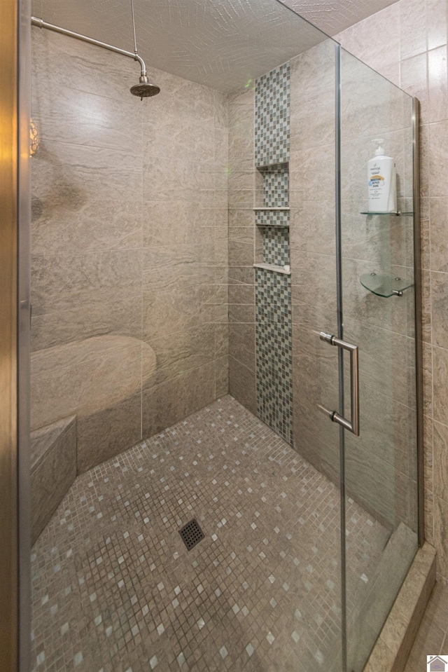 full bathroom featuring a stall shower