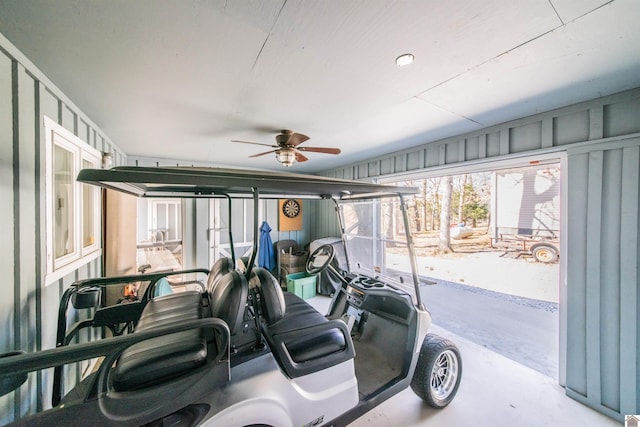 interior space with ceiling fan