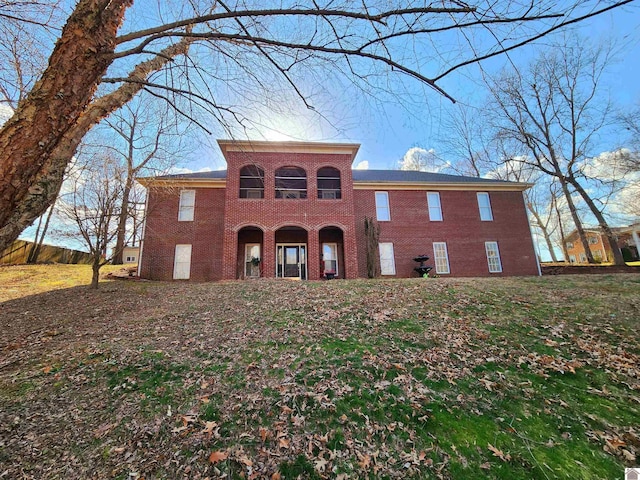 view of front of home featuring brick siding