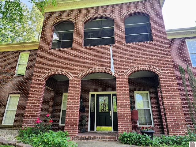 view of front of property featuring brick siding