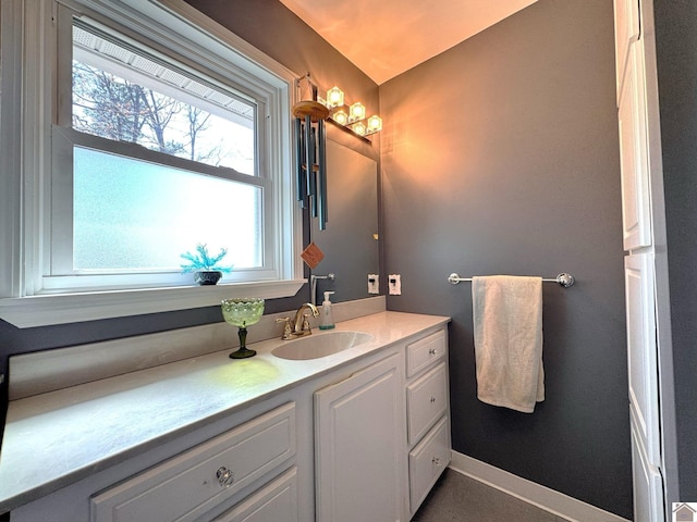 bathroom featuring vanity and baseboards