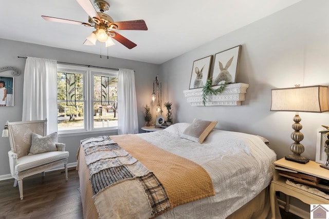 bedroom with wood finished floors, baseboards, and ceiling fan