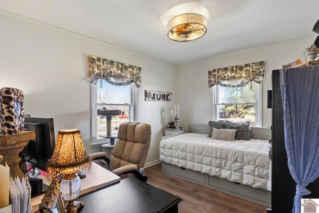 bedroom featuring wood finished floors