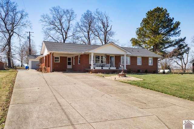 single story home with brick siding, concrete driveway, a front yard, covered porch, and a garage