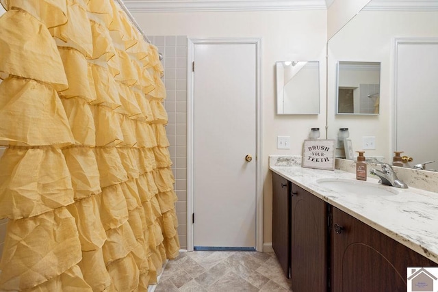 full bathroom featuring curtained shower, vanity, crown molding, and baseboards