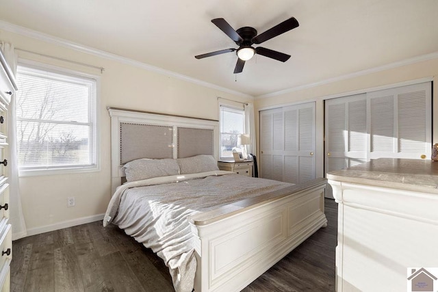 bedroom with crown molding, dark wood-type flooring, and baseboards