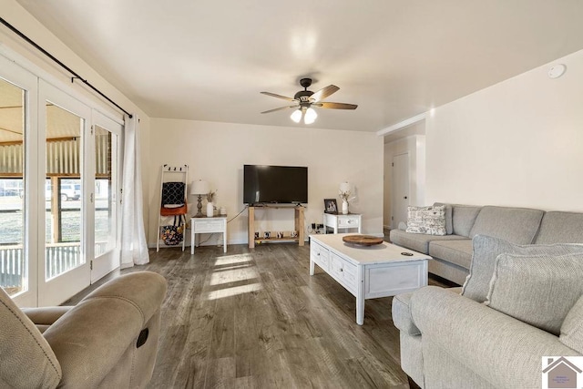 living room with dark wood finished floors and ceiling fan